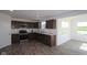 Well-lit kitchen with stainless steel appliances, ample cabinet space, and hardwood floors at 7329 Waylon Way, Indianapolis, IN 46239