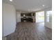 Open floor plan showcases a modern kitchen and living space with recessed lighting and wood floors at 7329 Waylon Way, Indianapolis, IN 46239