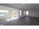 Spacious living room features recessed lighting, several windows, and hardwood flooring at 7329 Waylon Way, Indianapolis, IN 46239