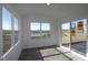 Bright sun room features floor-to-ceiling windows with an adjacent sliding glass door at 7329 Waylon Way, Indianapolis, IN 46239