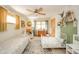 Bright bedroom with a ceiling fan and two beds at 806 Maplewood Ave, Anderson, IN 46012