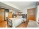Well-lit bedroom featuring a window and a vintage wooden sign at 806 Maplewood Ave, Anderson, IN 46012