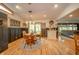 Cozy dining area with wood table, chair, and view to the exterior, open to the living room at 806 Maplewood Ave, Anderson, IN 46012