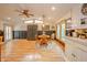 Bright dining area with wood table, modern lighting, and stylish accent wall at 806 Maplewood Ave, Anderson, IN 46012