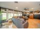 Inviting living room with hardwood floors, natural light, and seamless flow to a cozy seating area at 806 Maplewood Ave, Anderson, IN 46012