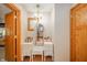 Charming dressing area with a vanity, stool and chandelier at 806 Maplewood Ave, Anderson, IN 46012