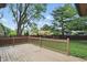 A charming back deck perfect for relaxing or entertaining, surrounded by lush greenery at 8218 San Carlos Ct, Indianapolis, IN 46256