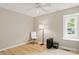 Bright bedroom with a fan, large window, and a dedicated workspace area at 8218 San Carlos Ct, Indianapolis, IN 46256