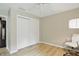 Bedroom with a closet, fan, large window, and a dedicated workspace area at 8218 San Carlos Ct, Indianapolis, IN 46256