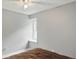 This bedroom has light grey walls, white trim, and one window allowing for natural light at 8218 San Carlos Ct, Indianapolis, IN 46256