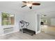 A bonus room with plenty of natural light coming in from an adjacent room through glass doors at 8218 San Carlos Ct, Indianapolis, IN 46256