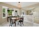 Charming dining area with large bay window and modern pendant lighting at 8218 San Carlos Ct, Indianapolis, IN 46256