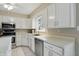 Updated kitchen features stainless steel appliances and a bright window at 8218 San Carlos Ct, Indianapolis, IN 46256