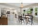 Bright eat-in kitchen features white cabinets, stainless steel appliances, and island at 8218 San Carlos Ct, Indianapolis, IN 46256