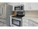 Close up of stainless steel oven, microwave and refrigerator in kitchen at 8218 San Carlos Ct, Indianapolis, IN 46256