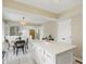 Open kitchen and dining area with center island and stainless appliances at 8218 San Carlos Ct, Indianapolis, IN 46256