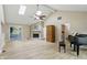 Bright living room with vaulted ceilings, fireplace, and elegant hardwood floors at 8218 San Carlos Ct, Indianapolis, IN 46256