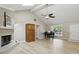 Cozy living room with fireplace, vaulted ceilings, and wood floors at 8218 San Carlos Ct, Indianapolis, IN 46256