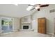 Bright living room with skylights, fireplace, and access to the sunroom at 8218 San Carlos Ct, Indianapolis, IN 46256