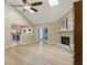 Open living room with wood floors flowing to the kitchen and sunroom at 8218 San Carlos Ct, Indianapolis, IN 46256