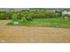 Acreage with a long driveway leading to a house and surrounded by open fields and mature trees at 8293 Water St, Coatesville, IN 46121