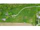Aerial view of rural acreage with a long driveway leading to a house and adjacent farm fields at 8293 Water St, Coatesville, IN 46121