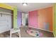 Bedroom featuring multi-colored walls, standard carpeting, and a closet, showing a simple layout at 8293 Water St, Coatesville, IN 46121