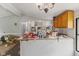 A view of the combined kitchen and living room, ready for improvements and updates at 8293 Water St, Coatesville, IN 46121