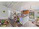 A view of the combined kitchen and living room, ready for improvements and updates at 8293 Water St, Coatesville, IN 46121
