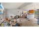 Open-concept living area flows into the kitchen, ready for updates at 8293 Water St, Coatesville, IN 46121