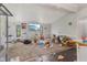 The view of a living space with a TV mounted on the wall and natural light from the window at 8293 Water St, Coatesville, IN 46121