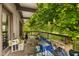 Overgrown porch displaying outdoor living space framed by lush foliage and mature trees at 8293 Water St, Coatesville, IN 46121