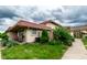 A view of the side of a home showcasing green lawn and mature landscaping at 8362 Punto Alto Dr, Indianapolis, IN 46227