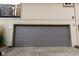Attached garage with a gray sectional door and 'Tow Away Zone' sign at 8362 Punto Alto Dr, Indianapolis, IN 46227
