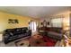 Spacious living room with a brick accent wall, two couches and a decorative rug at 8362 Punto Alto Dr, Indianapolis, IN 46227