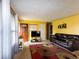 Bright living room with large windows, hardwood floors, and a comfortable sofa at 8362 Punto Alto Dr, Indianapolis, IN 46227