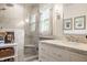 Elegant bathroom with marble tiling, glass shower, and vanity with marble countertop at 8770 N Pennsylvania St, Indianapolis, IN 46240