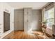 Bedroom featuring hardwood floors, gray walls, and built-in closet storage at 8770 N Pennsylvania St, Indianapolis, IN 46240