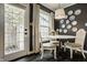 Charming eat-in kitchen features a lovely lighting fixture, dark hardwood floors, and lots of natural light at 8770 N Pennsylvania St, Indianapolis, IN 46240