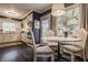 Cozy kitchen and dining area features a breakfast nook perfect for Gathering meals and entertaining at 8770 N Pennsylvania St, Indianapolis, IN 46240