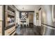 Eat-in dining area filled with natural light and stainless steel appliances and dark hardwood floors at 8770 N Pennsylvania St, Indianapolis, IN 46240