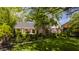 Well-maintained home with lush green lawn and mature landscaping, providing excellent curb appeal at 8770 N Pennsylvania St, Indianapolis, IN 46240