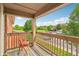 Enjoy beautiful views from this cozy balcony seating area at 8910 Hunters Creek Dr # 207, Indianapolis, IN 46227