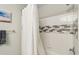 This bathroom showcases a modern tiled shower behind a white shower curtain at 8910 Hunters Creek Dr # 207, Indianapolis, IN 46227