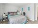 Modern bedroom features a comfy bed, carpet, and neutral decor at 8910 Hunters Creek Dr # 207, Indianapolis, IN 46227