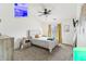 This bedroom features a ceiling fan, carpet, a window, and simple decor at 8910 Hunters Creek Dr # 207, Indianapolis, IN 46227