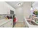 Bright kitchen with stainless steel appliances and white cabinets at 8910 Hunters Creek Dr # 207, Indianapolis, IN 46227