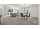 Spacious living room with gray sofa, fireplace, and adjoining dining area at 8910 Hunters Creek Dr # 207, Indianapolis, IN 46227