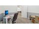 Bright home office with neutral carpet and walls, perfect for working remotely at 8910 Hunters Creek Dr # 207, Indianapolis, IN 46227