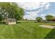 Spacious backyard with well-maintained lawn and storage shed, perfect for outdoor enjoyment at 897 N Scott Dr, Greenwood, IN 46142